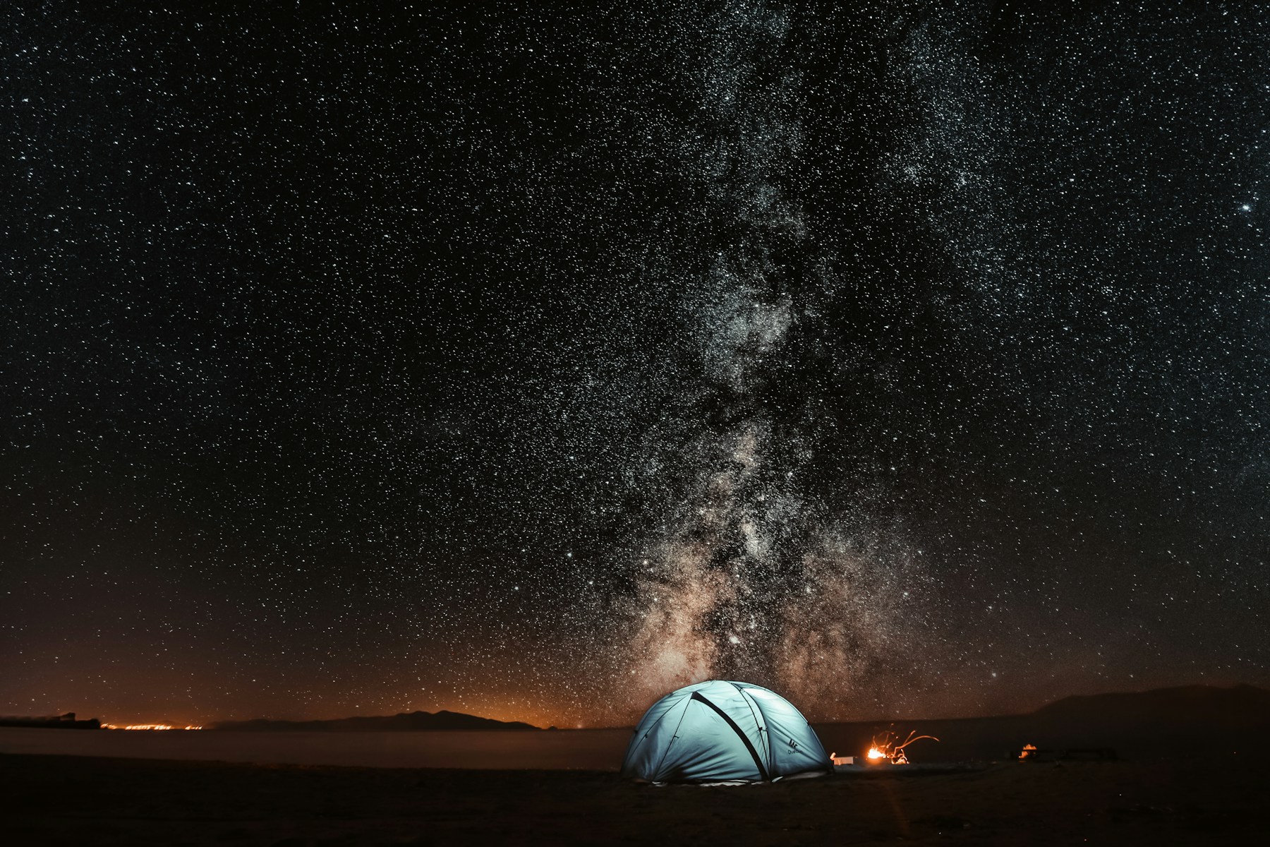 A conservation camp beneath a clear night sky