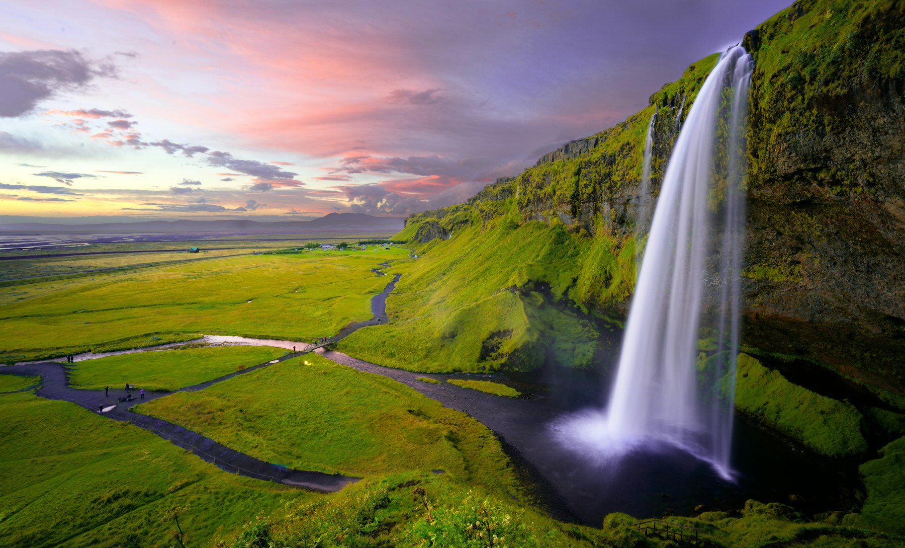 Waterfall flowing through a protected green landscape